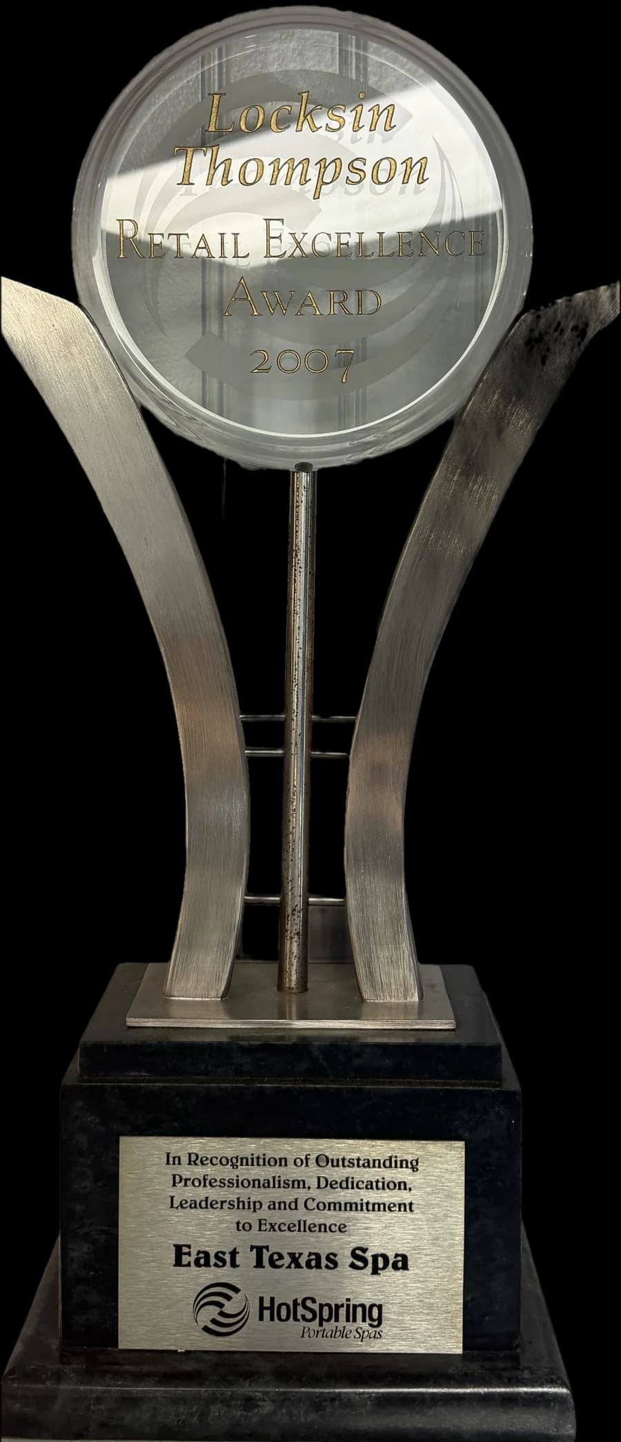 The Locksin Thompson Retail Excellence Award trophy Hot Spring presented to East Texas Spa in 2007
