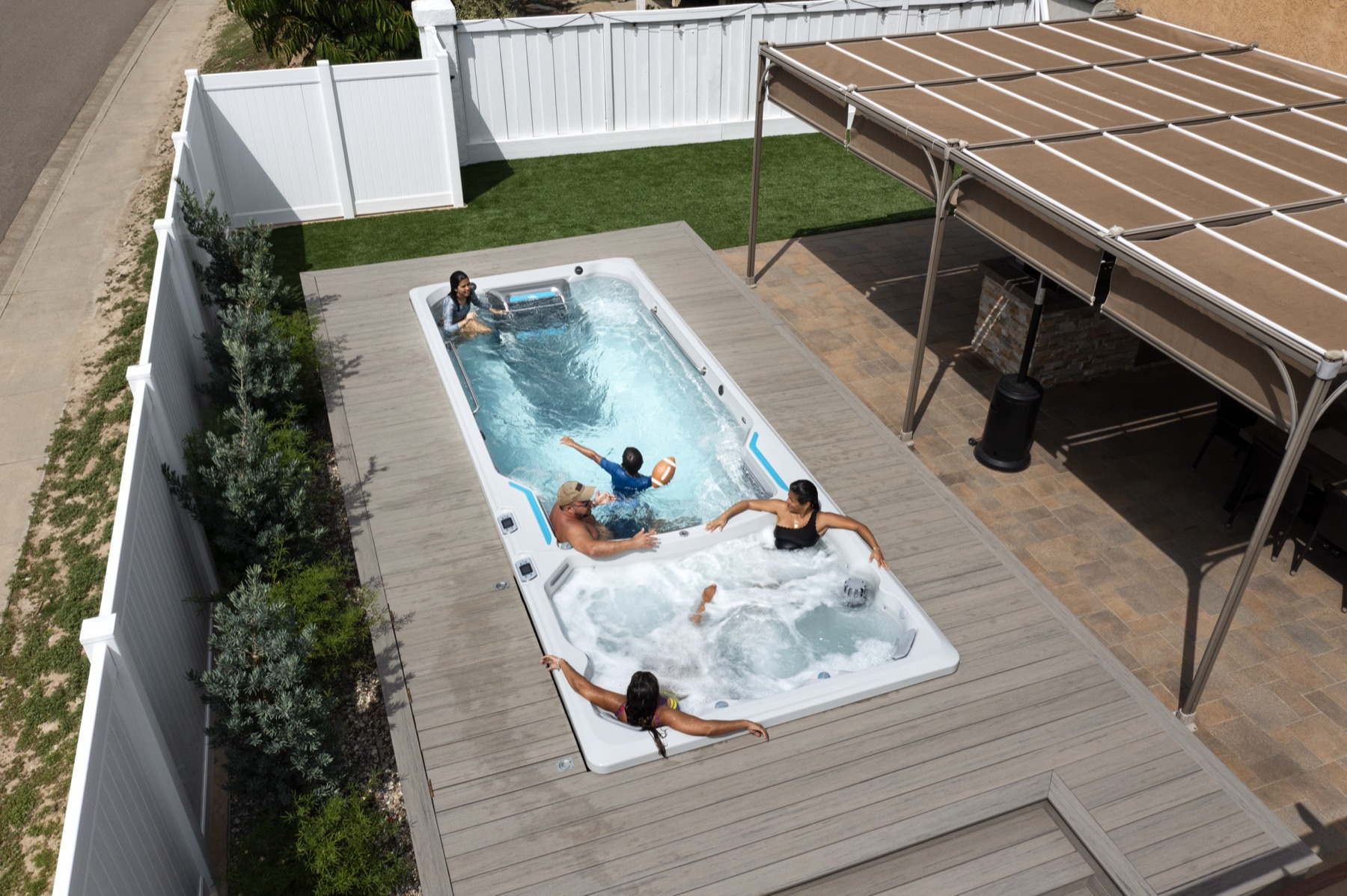 A family in an Endless Pools swim spa